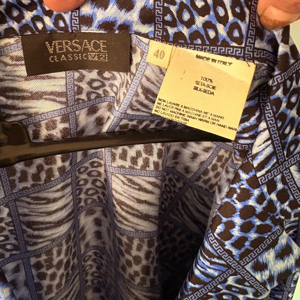 Versace 100%pure silk Blue toned Animal print blouse. Brand New, Never worn.